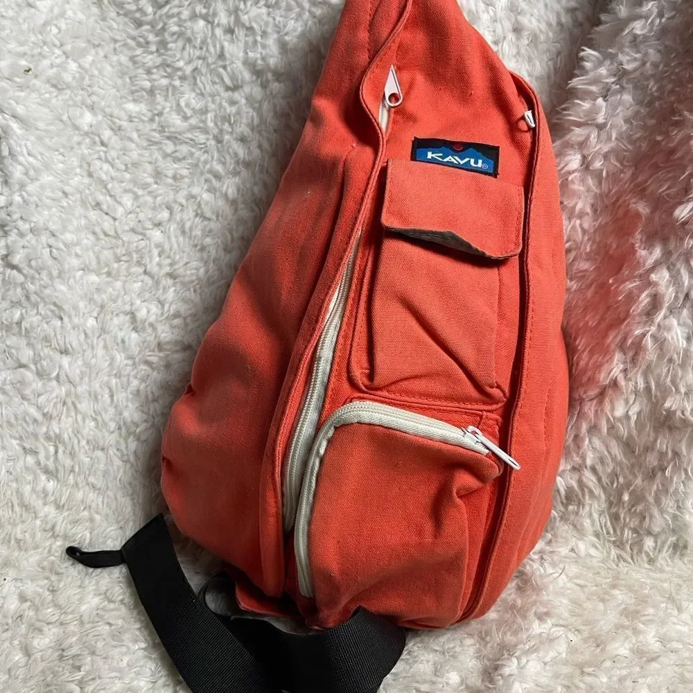 Kavu rope sling back canvas orange backpack with two vertical zipper.
